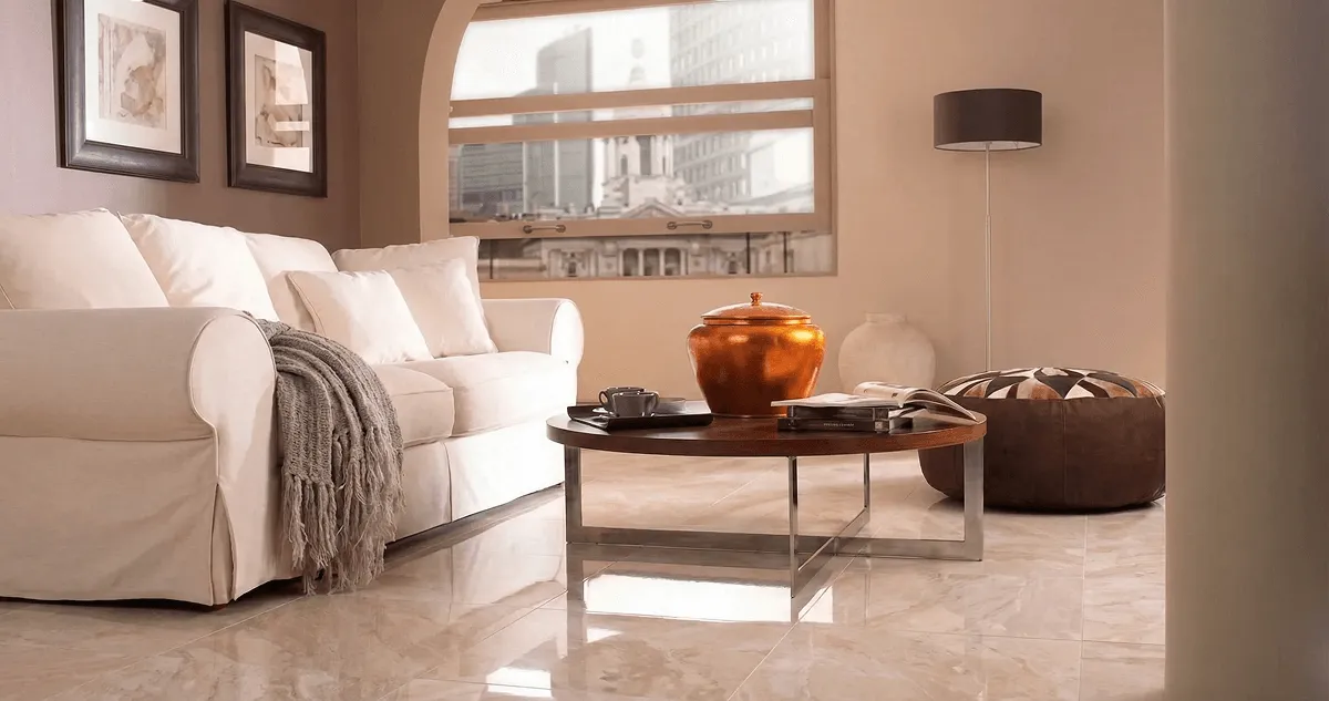 Modern living room with professionally installed marble flooring, a beige sofa, coffee table in Cleveland, OH