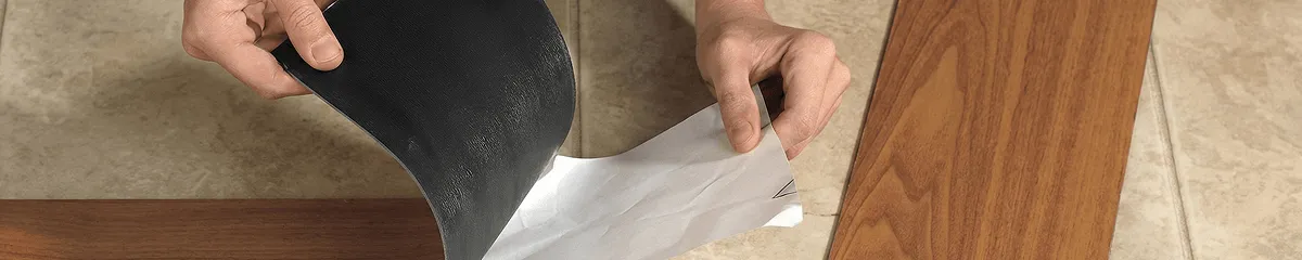 A professional installing vinyl flooring in Cleveland, OH